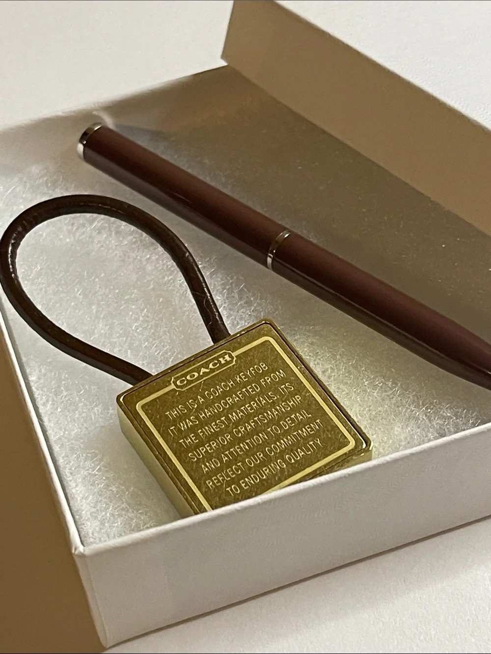Coach Gold-Tone Brass Key Fob with Brown Leather Loop and Coach Pen